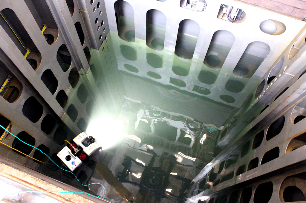 A remotely-operated vehicle (ROV) is deployed in the moon pool of the Sir David Attenborough during trials.